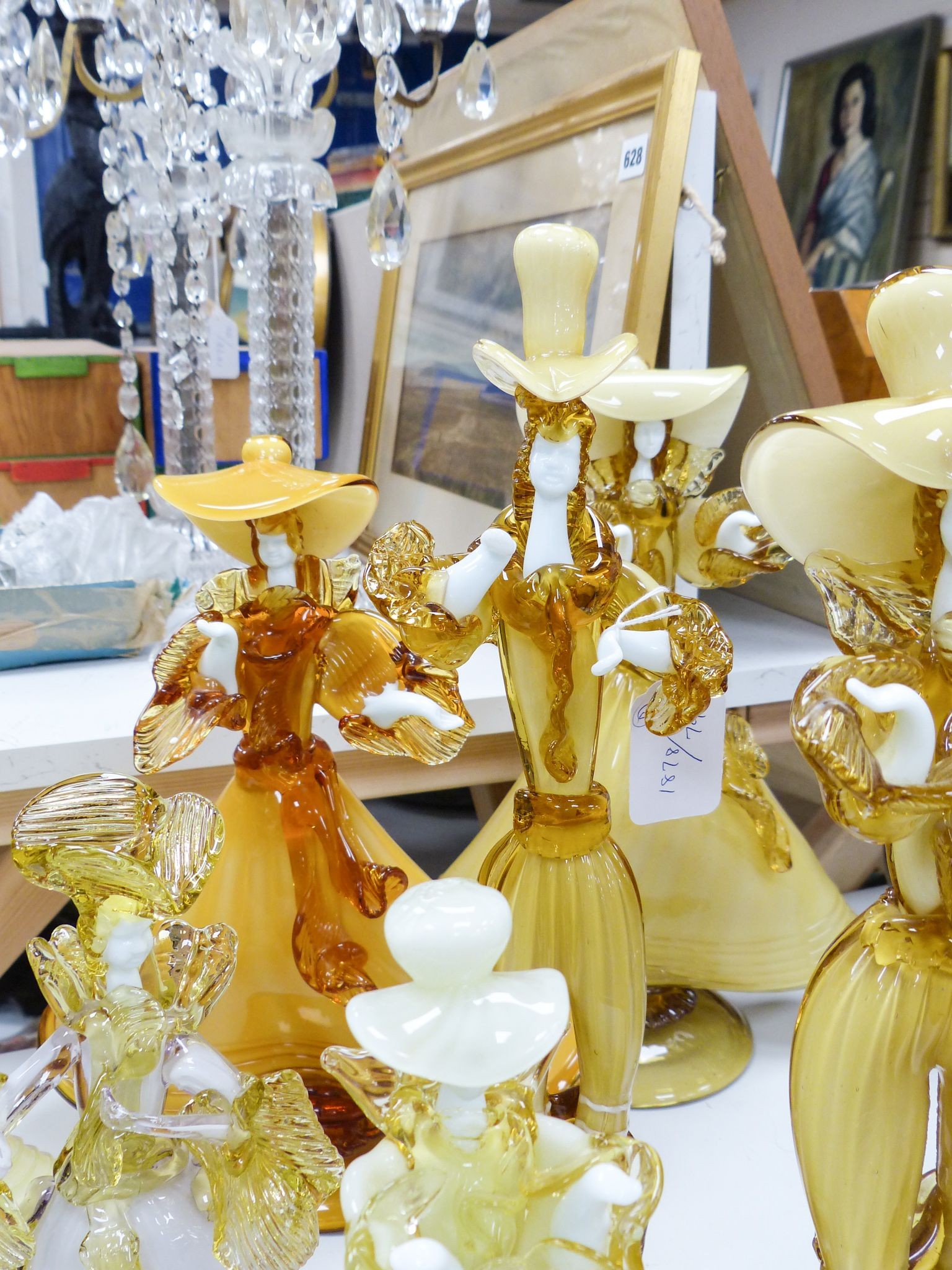 A collection of eight Murano amber glass figures, tallest 42cm